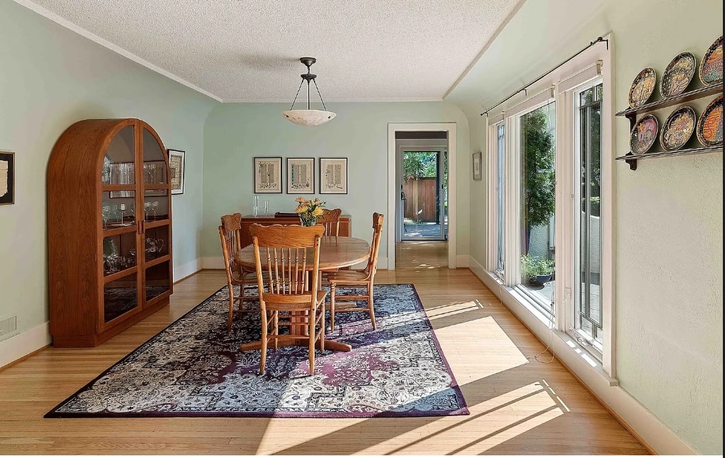 Historic dining room with plaster walls and period furnishings
