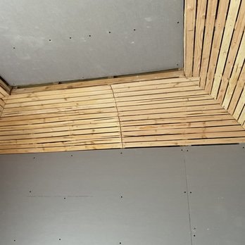 Lath strips and drywall installation during historic plaster repair