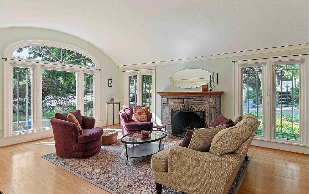 Historic living room with vaulted plaster ceiling and arched window